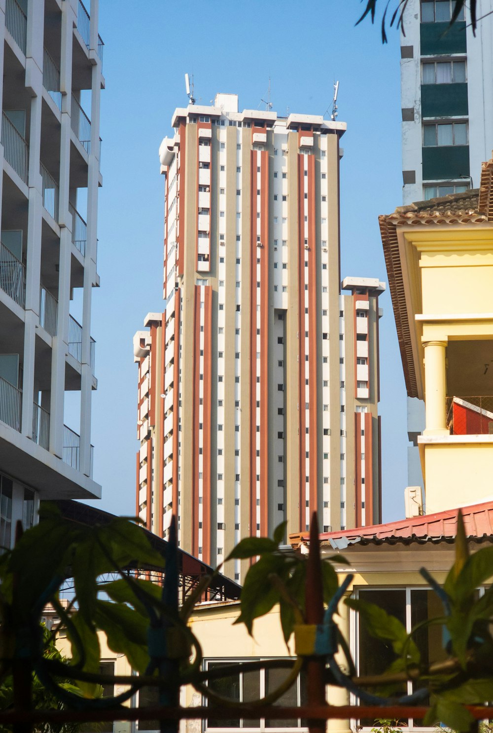 a view of a tall building from across the street