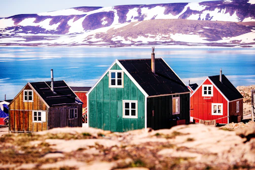 a group of small houses sitting on top of a rocky hillside