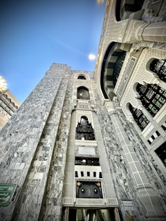 Wide shot of a building facade featuring detailed masonry and metalwork