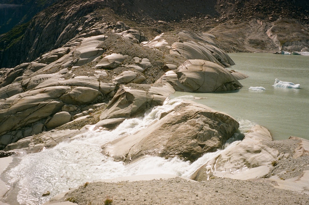 a large body of water surrounded by rocks