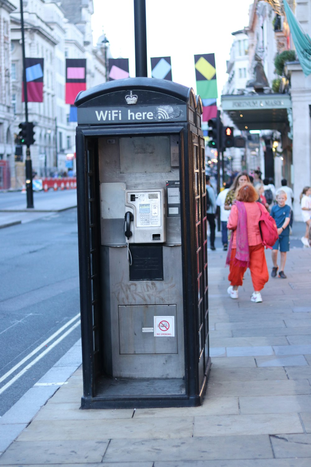 a public phone booth on a city street