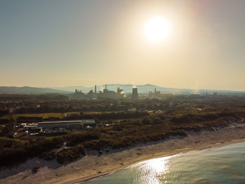 A serene landscape showcasing a desalination plant by the sea.