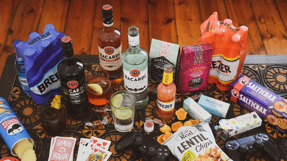 a table topped with lots of different types of liquor