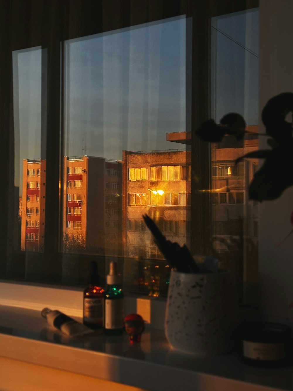 a window with a view of a city at night