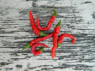 Close-up of traditional Mexican chili peppers on a rustic wooden table.