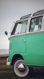 A close-up of a fleet manager reviewing insurance documents beside a company van.