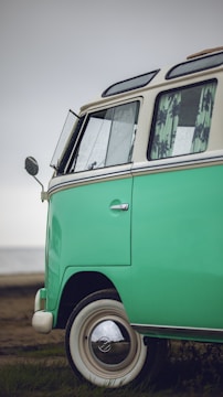 A close-up of a fleet manager reviewing insurance documents beside a company van.