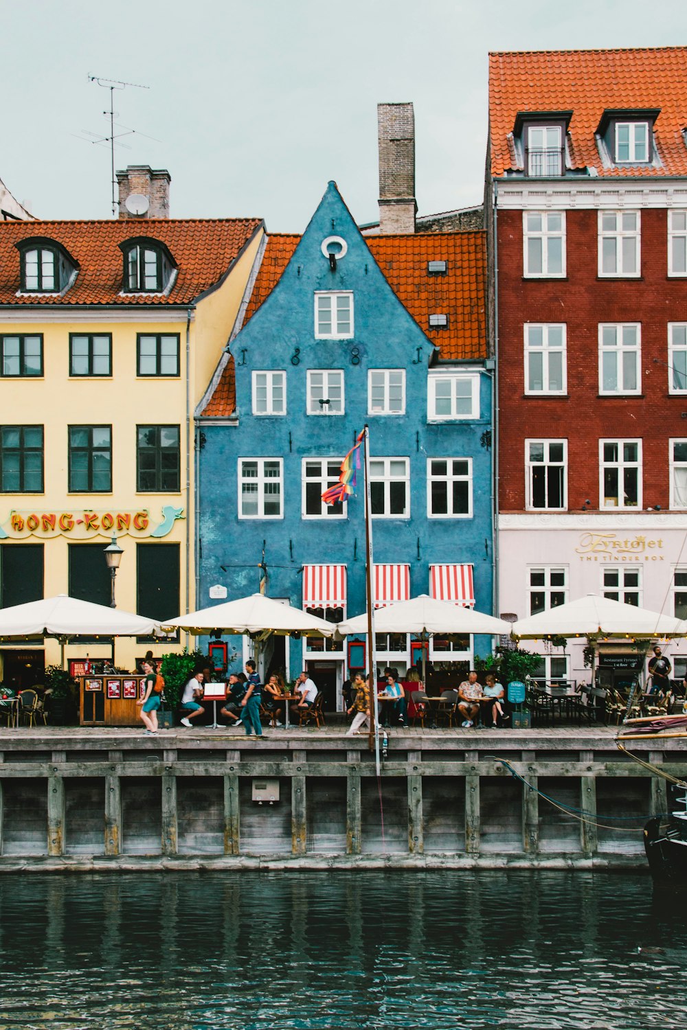 a row of buildings next to a body of water