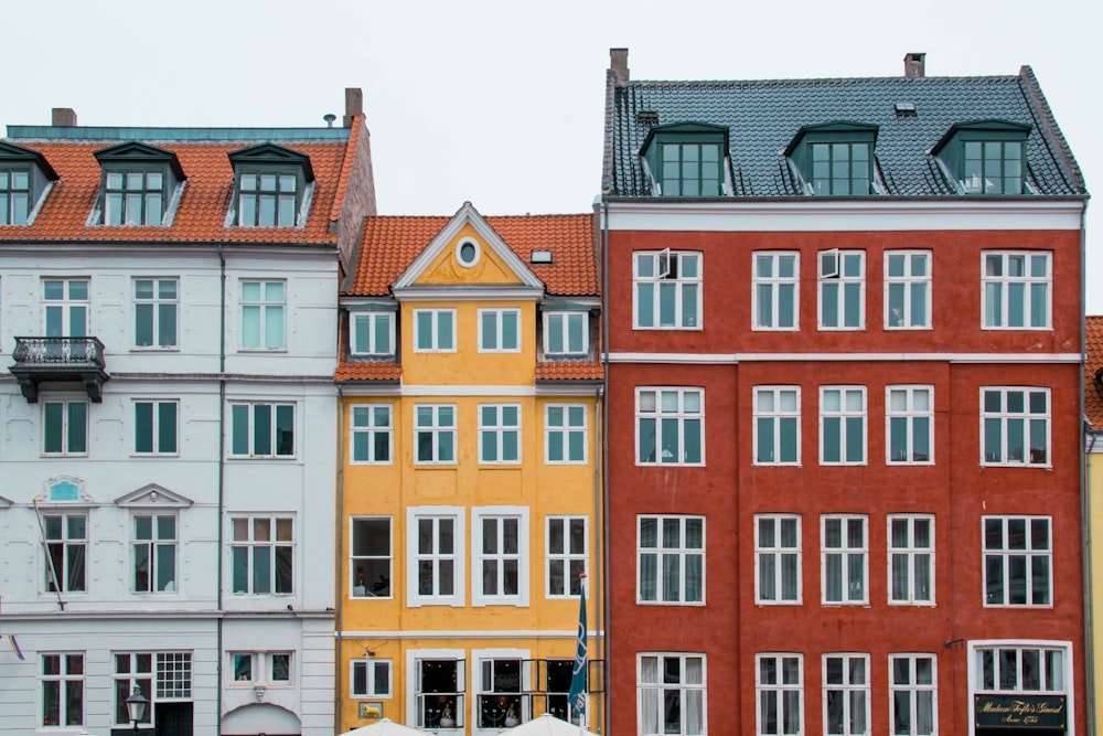 a row of buildings with umbrellas in front of them