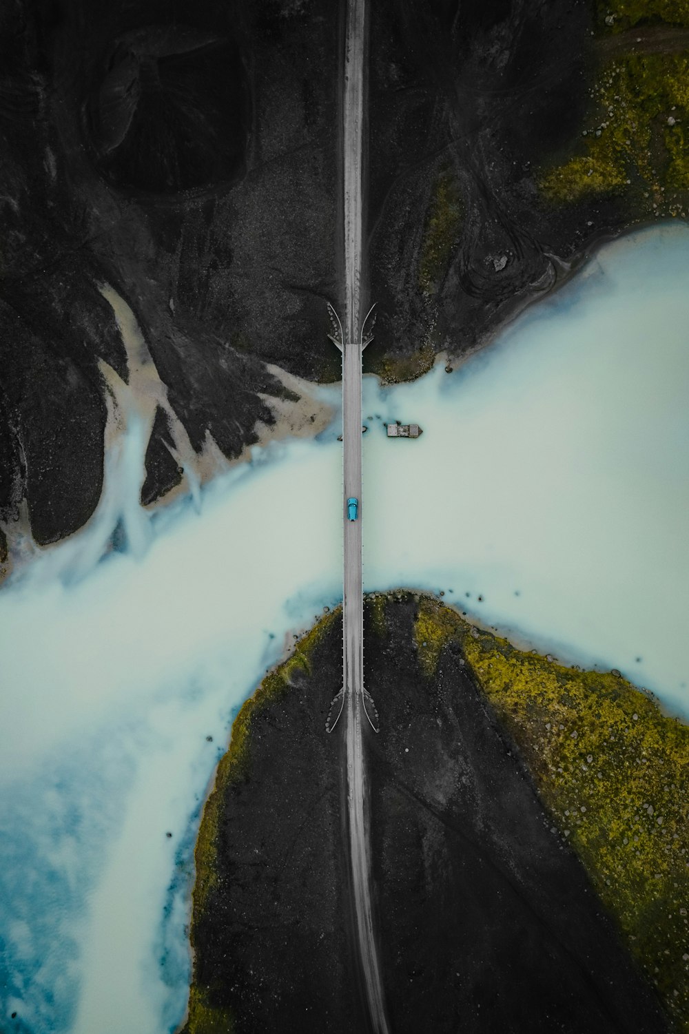 an aerial view of a road in the snow