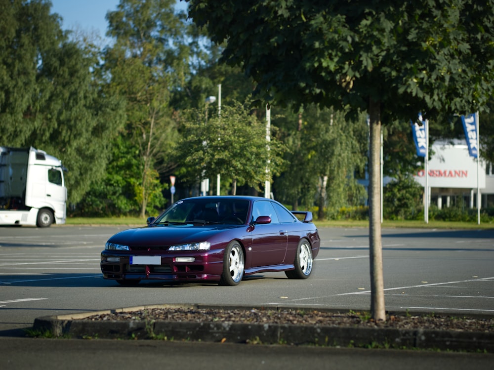 a purple sports car parked in a parking lot