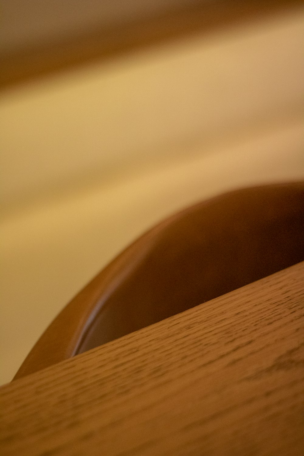 a close up of a wooden table with a blurry background