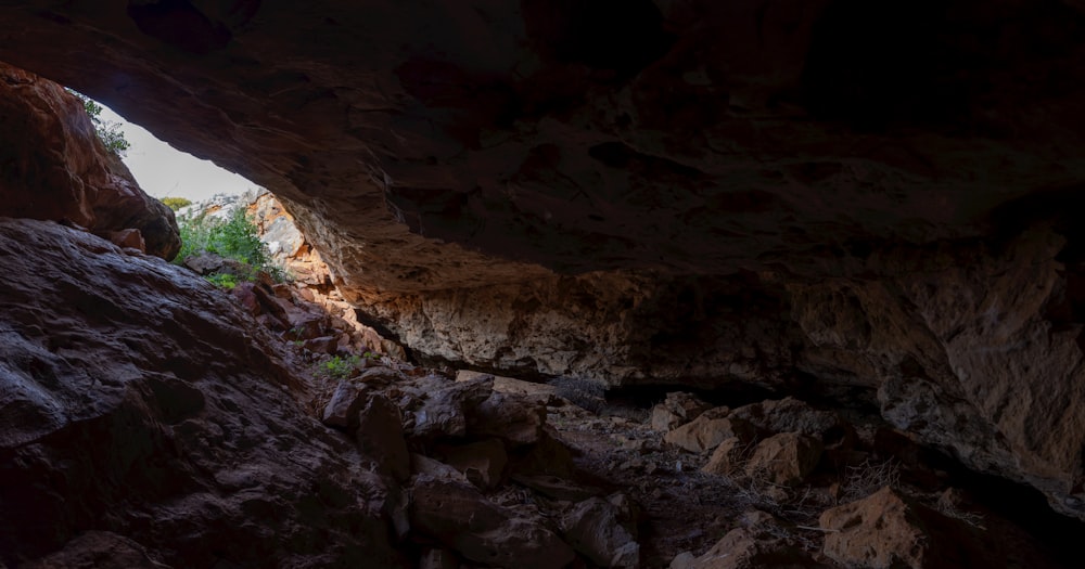 a cave filled with lots of rocks and water