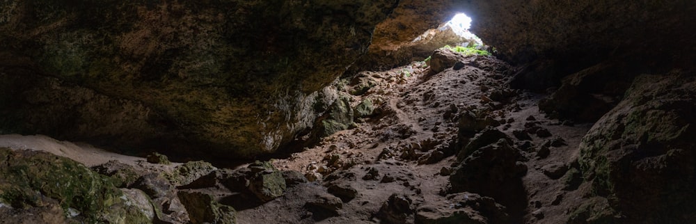 a cave with a light at the end of it