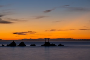 A breathtaking sunset over the Okinawa coastline, symbolizing tranquility.