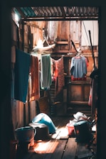 A cozy laundry shop interior with warm lighting and neatly folded clothes.