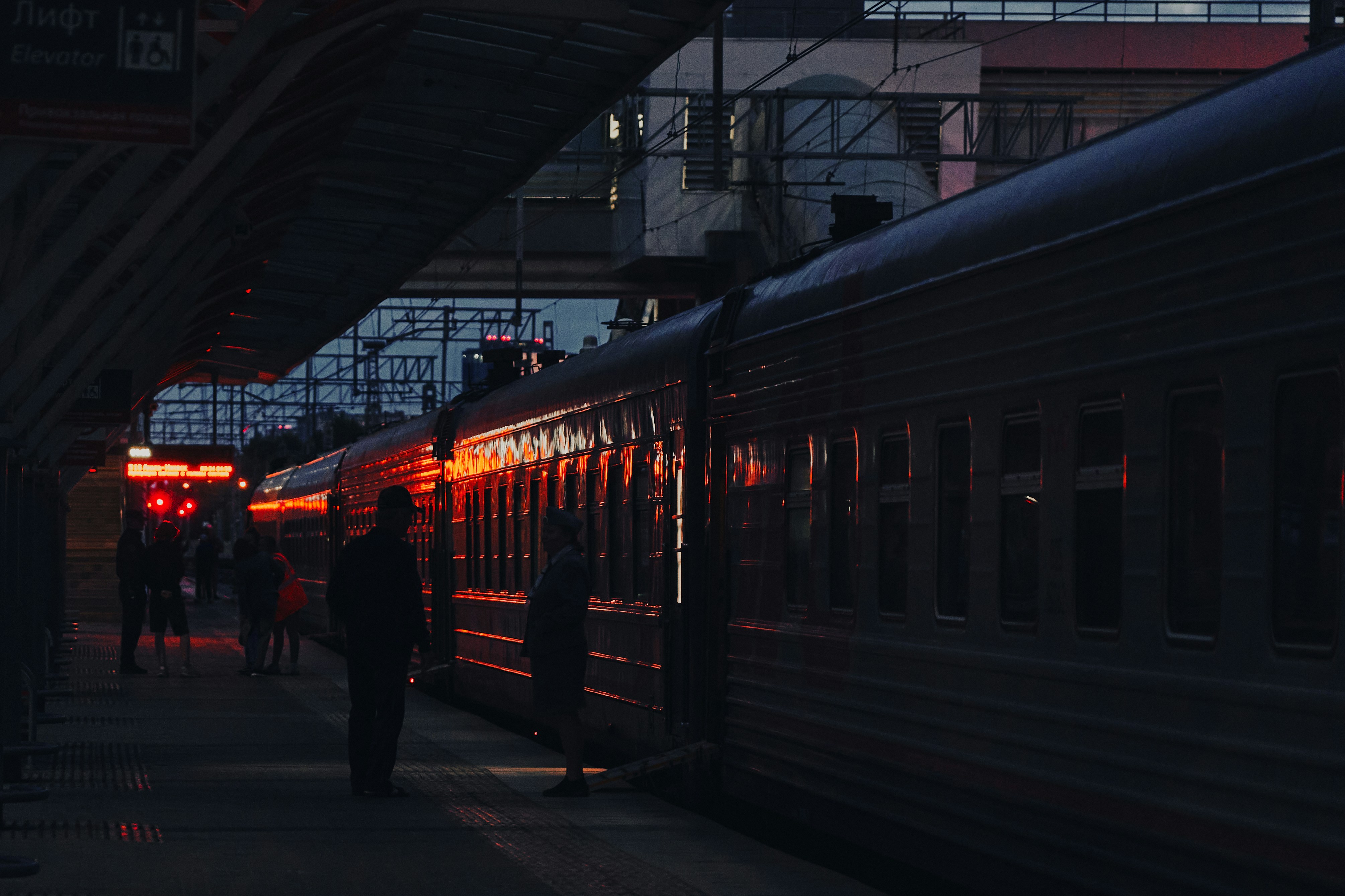 a train at a train station at night