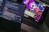Two open laptops are placed side by side on a desk. One laptop displays a coding interface with lines of code in various colors, while the other shows a vibrant, abstract website design with bold text and colorful shapes.