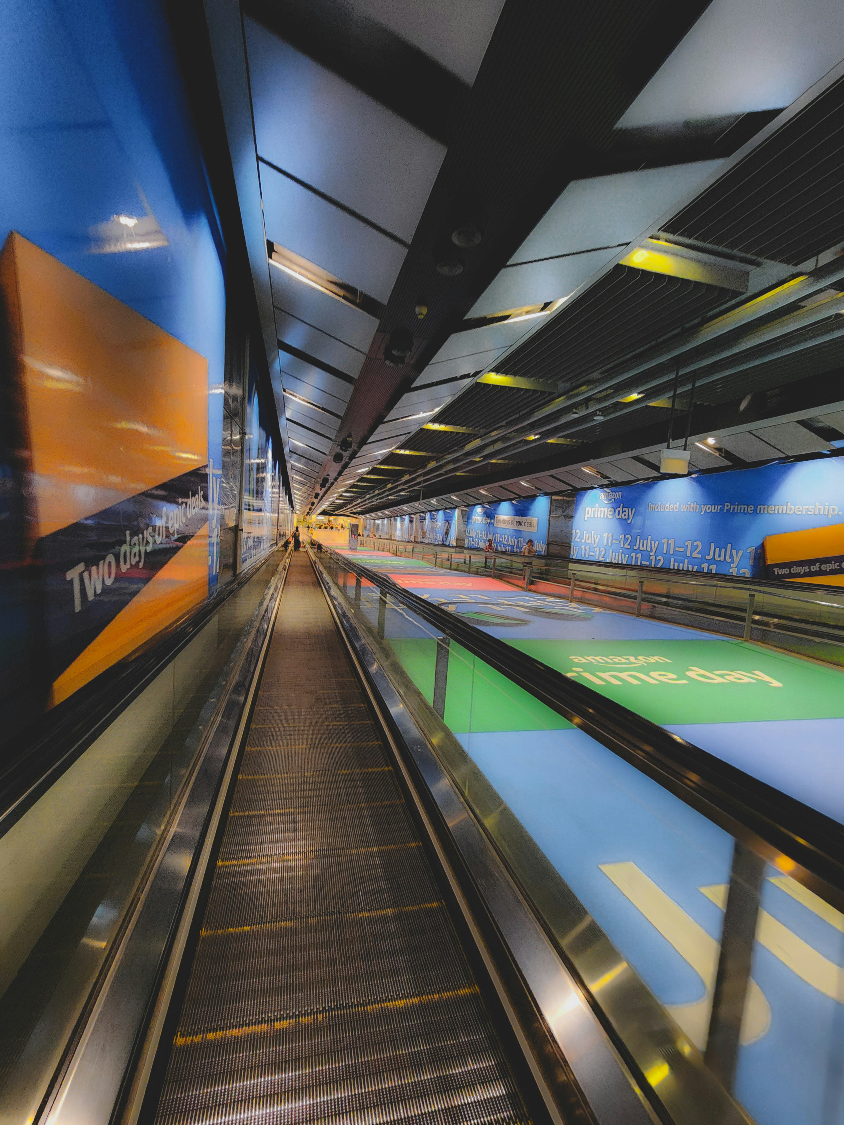 a train traveling through a train station next to a loading platform