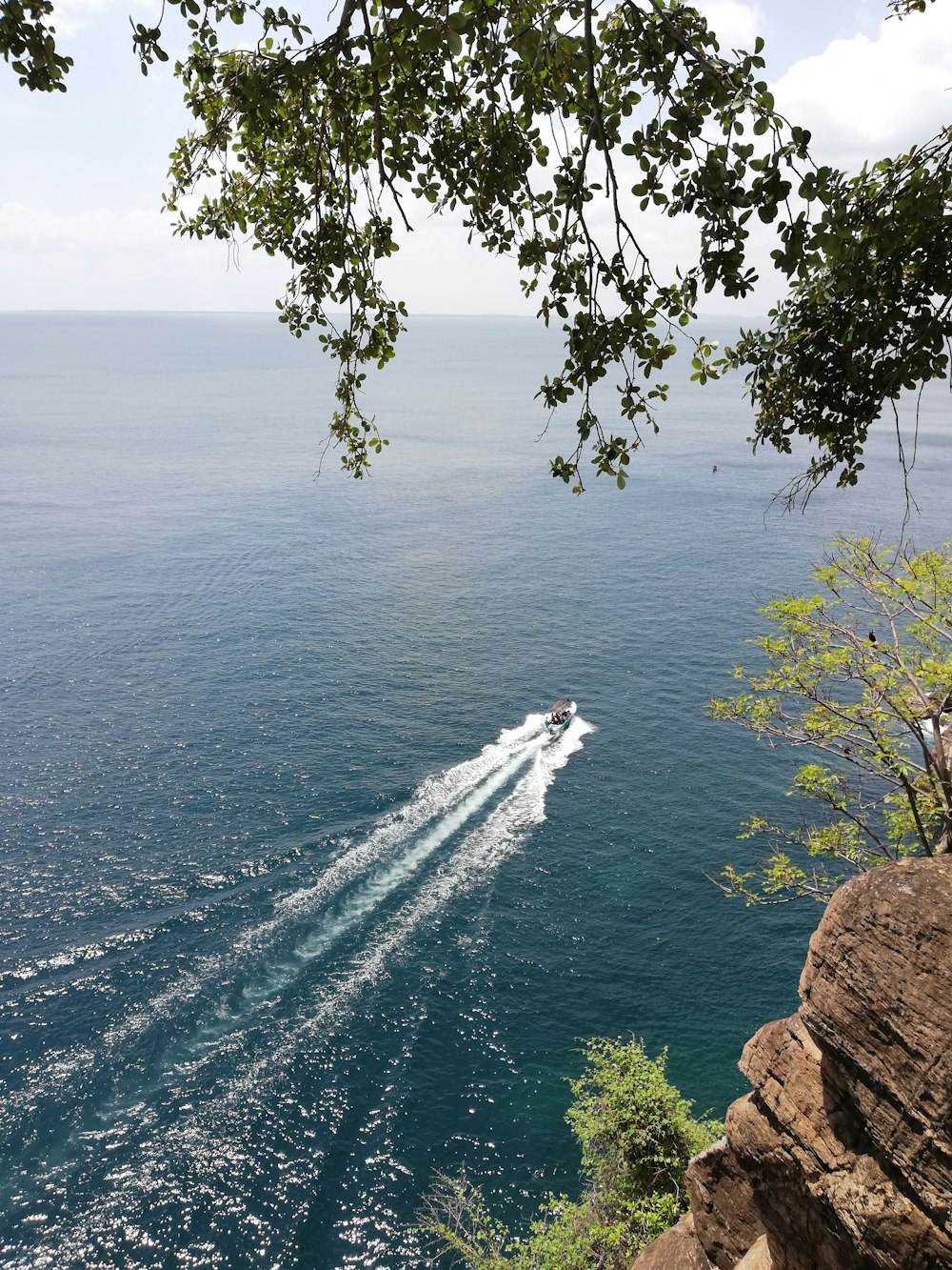 a boat traveling across a body of water