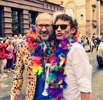 Guests dressed up with feather boas and oversized sunglasses, captured mid-laugh in the photobooth.