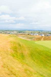 A vibrant rural landscape showcasing farmland and community interaction.