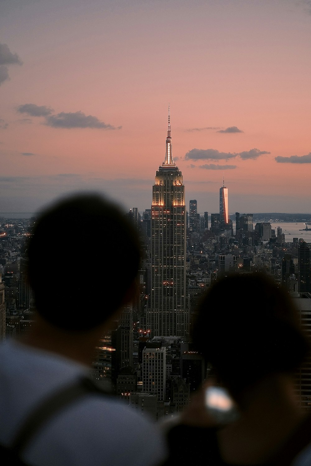 a couple of people that are looking at a city