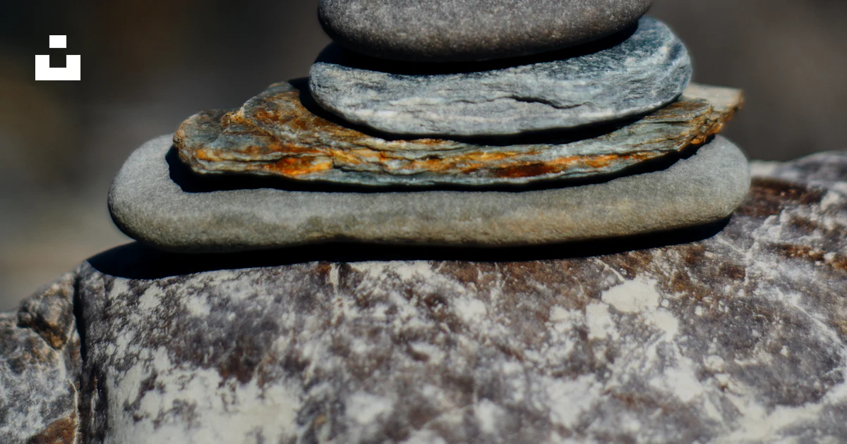 Rust Stack Of Rocks A stack of rocks sitting on top of a rock photo – Free Rust Image on ...