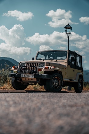A cozy, clean vehicle parked near the iconic mountains of Sharm with clear skies.