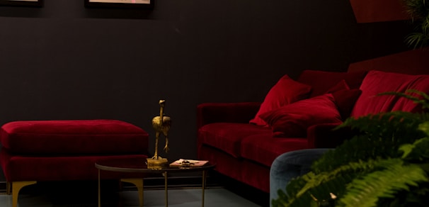 A luxurious velvet sofa in a modern living room setting with warm lighting.
