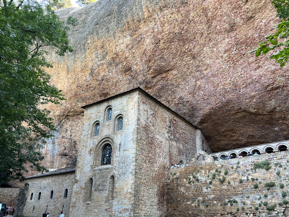 a large rock formation with a church built into it