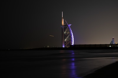 A sleek high-rise Damac residential tower glowing at sunset in Dubai Marina.