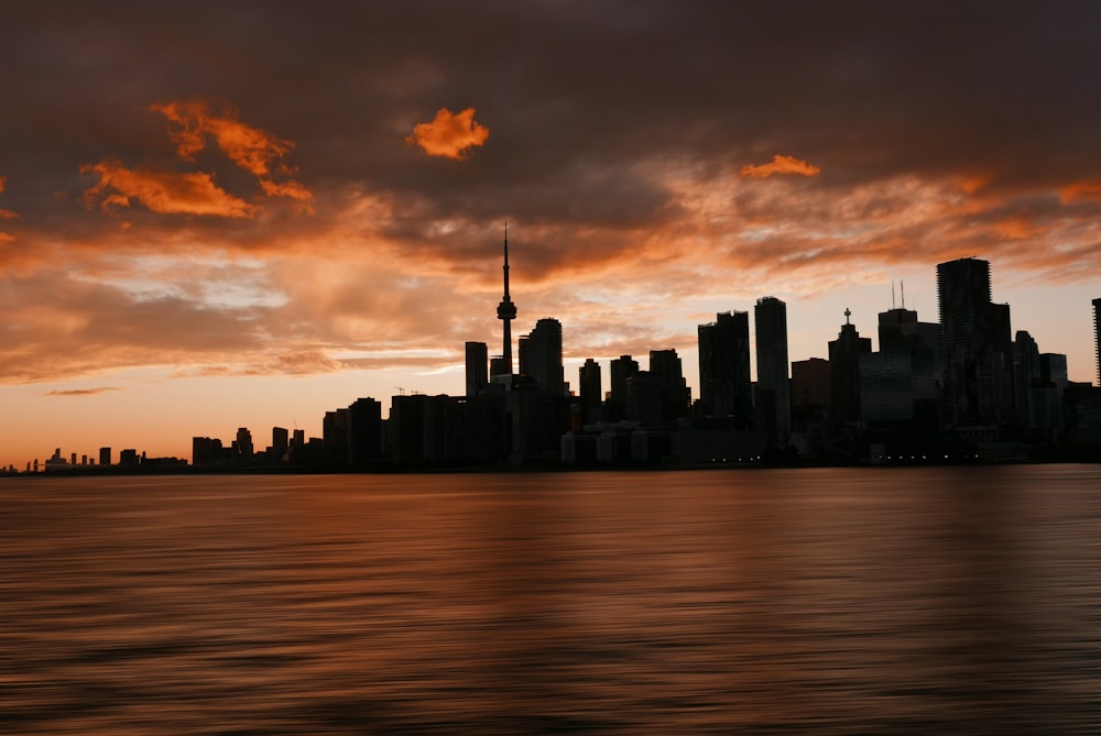 a view of a city skyline at sunset