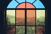 a view of a city through a stained glass window