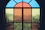 a view of a city through a stained glass window
