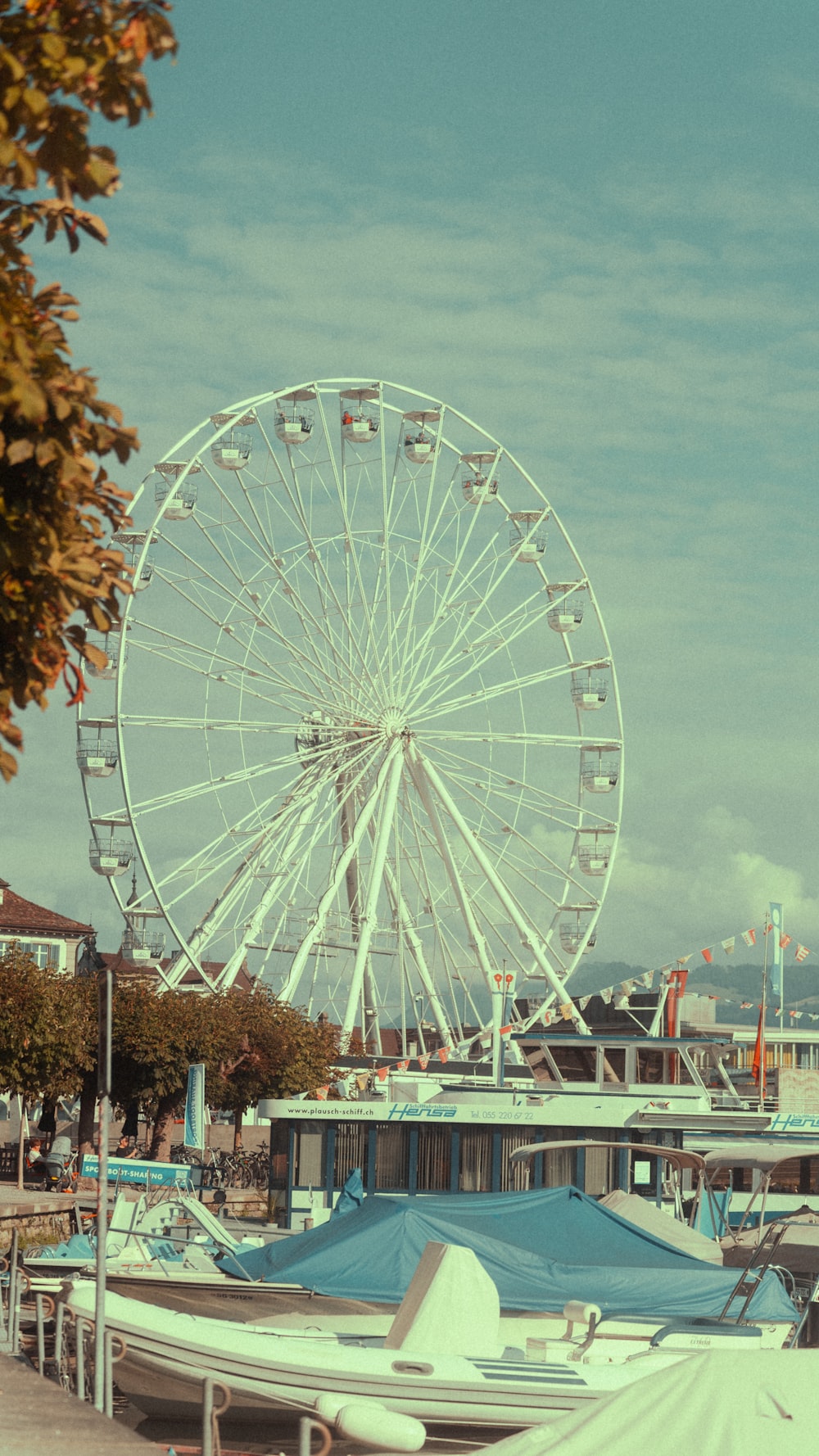 a ferris wheel sitting on top of a pier