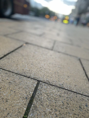Close-up of smooth, durable concrete sidewalk with clean edges at a retail center.