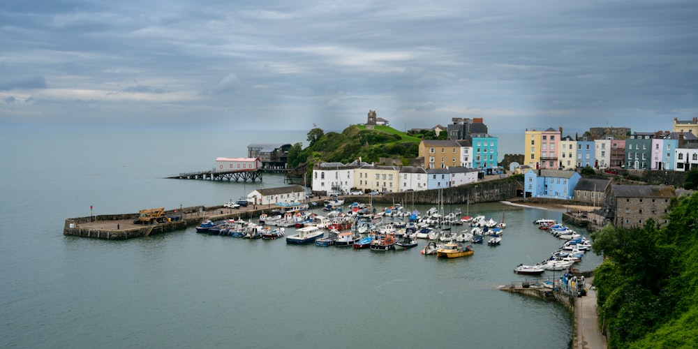 a harbor filled with lots of boats under a cloudy sky