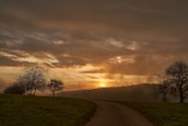 A serene landscape with a winding path, illustrating the journey towards a meaningful life.