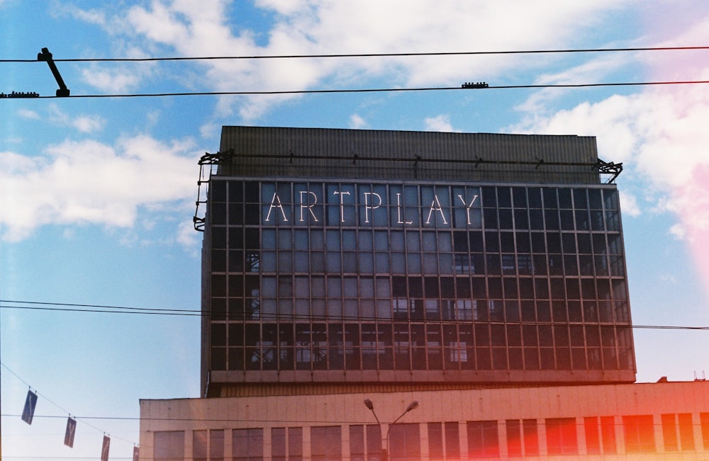 a building with a sign that says art play on it