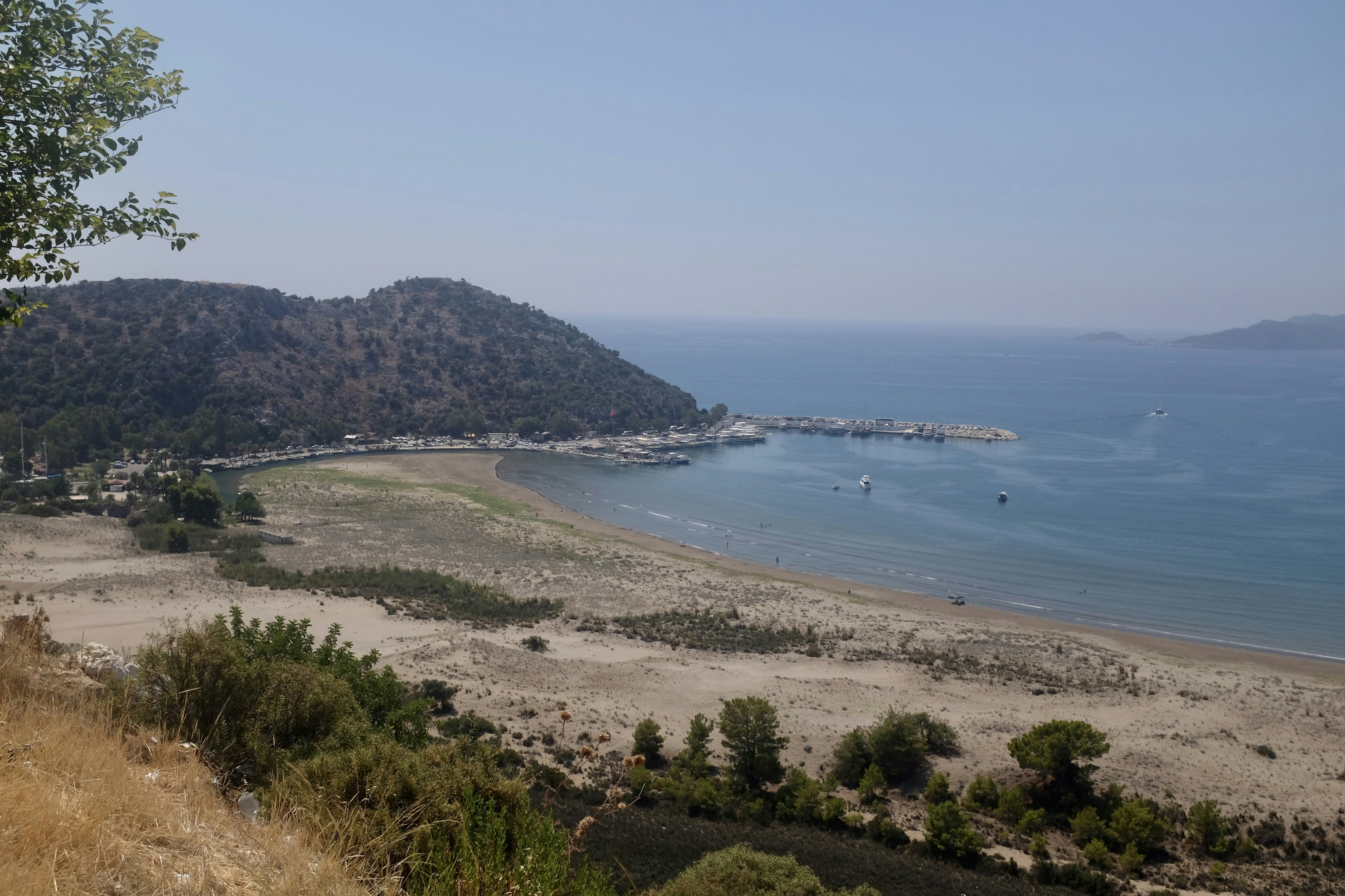a view of a beach from a hill