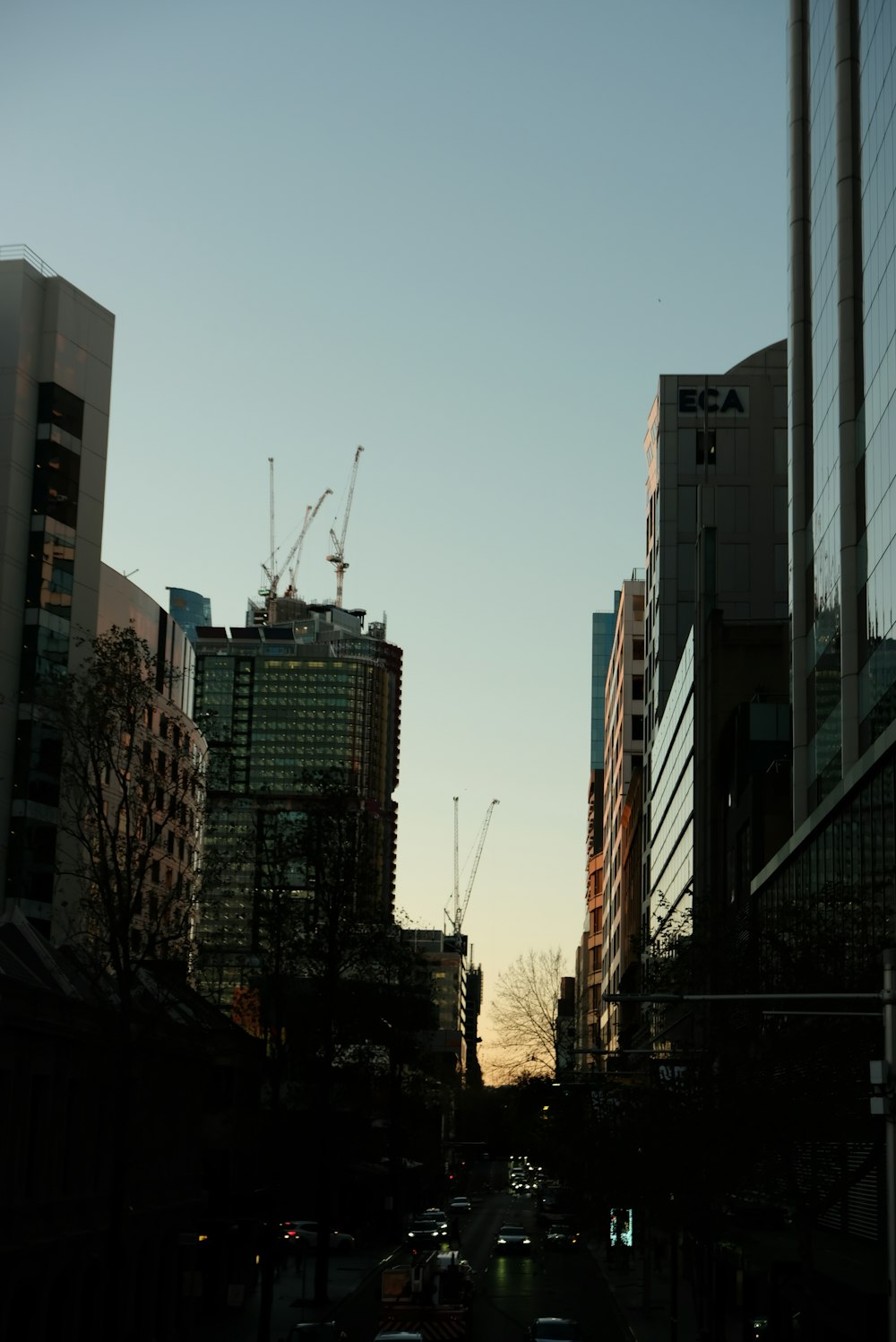 a city street filled with lots of tall buildings