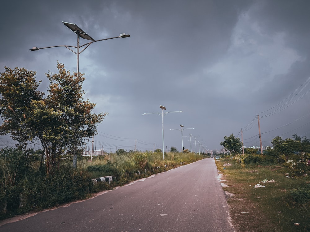 a street light on a cloudy day in a rural area