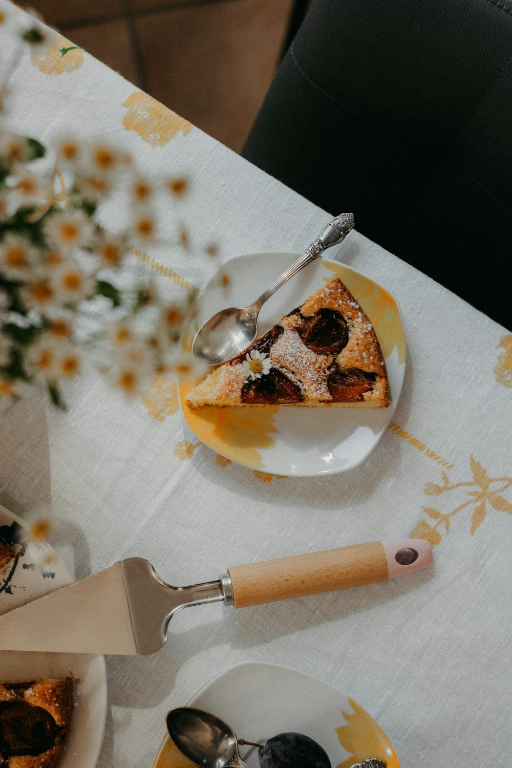 a table topped with plates of food and utensils