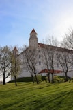 a large white building with a clock tower