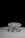 A large industrial valve with a wheel-shaped handle is attached to a flat surface. The valve and handle are prominently featured against a black background, casting distinct shadows on the surface. The simplicity and stark contrast give a dramatic effect to the mechanical object.