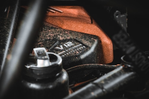 Engraved metal label affixed to a car engine component