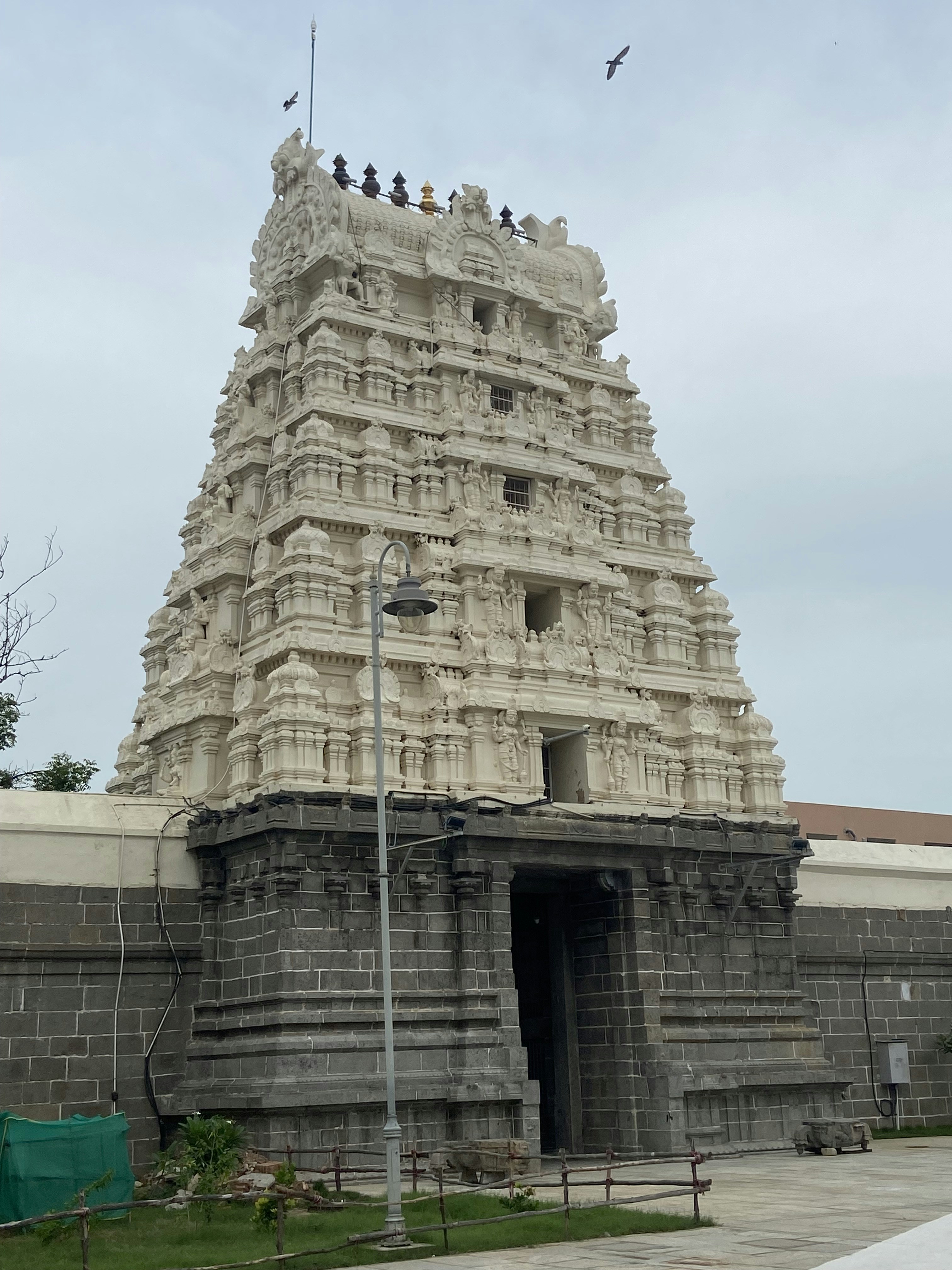 a very tall building with a bunch of people on top of it