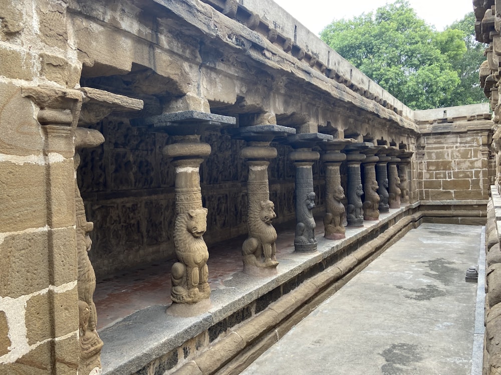 a row of stone pillars in a building