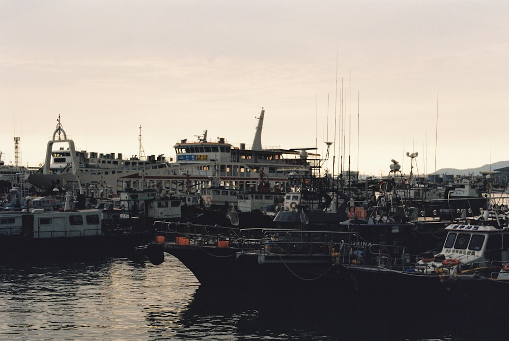 a group of boats that are sitting in the water